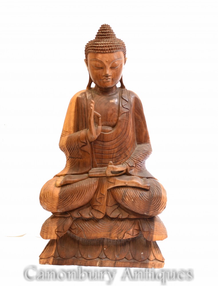 Резная статуя тибетского Будды - искусство позы лотоса буддизма